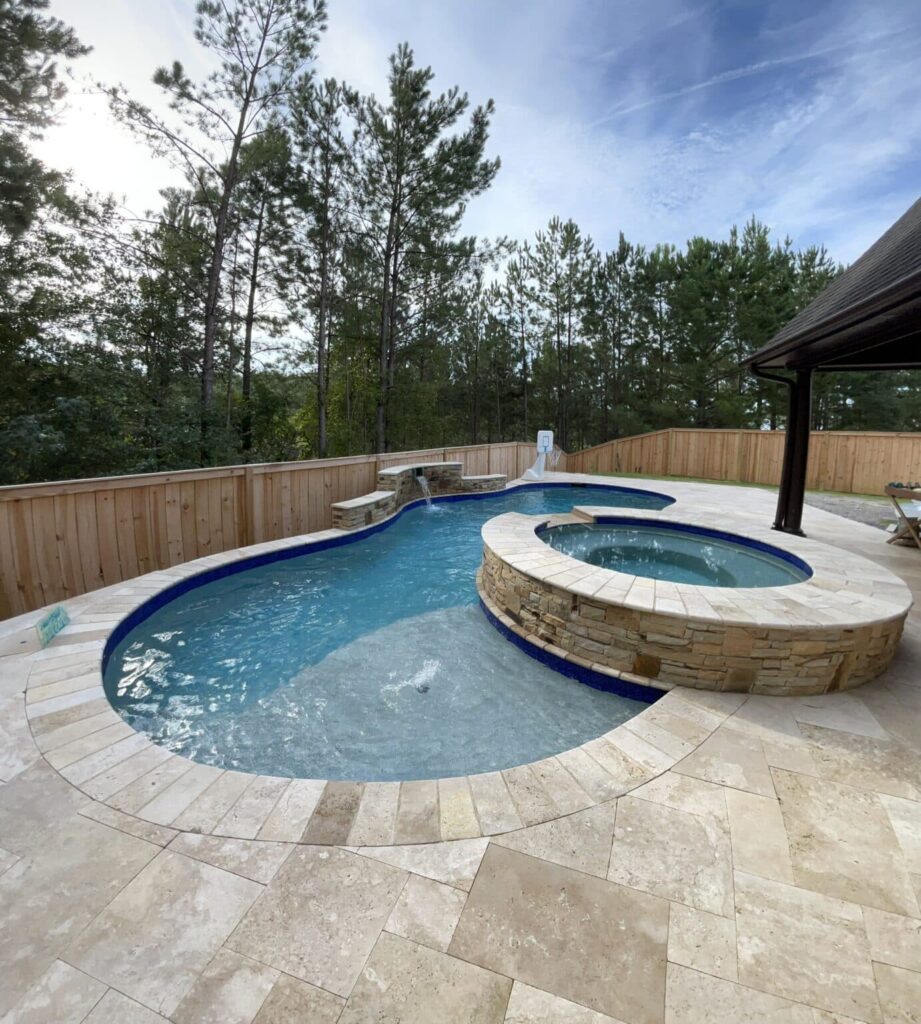 Backyard pool with spa and slide.