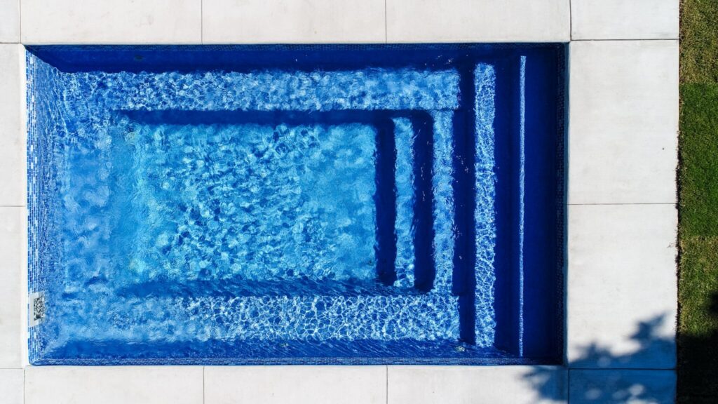Rectangular blue swimming pool from above
