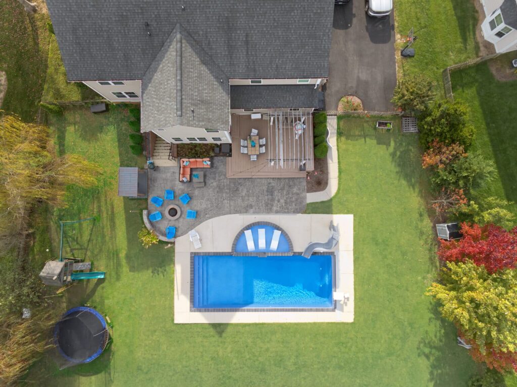 Aerial view of backyard with pool.