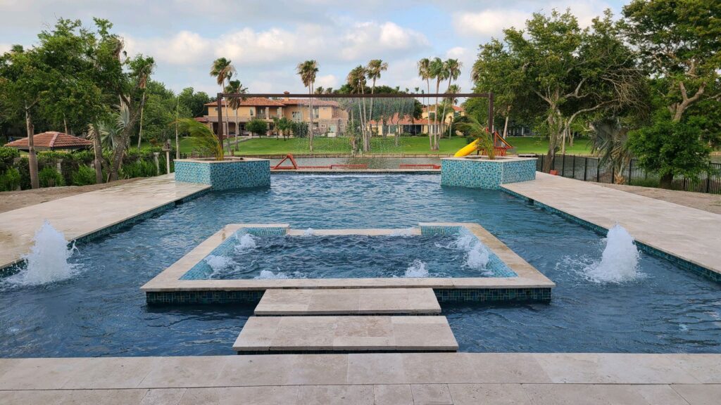 Luxury pool with fountains and greenery