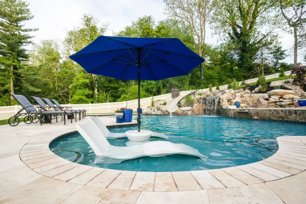 Pool with umbrella and lounge chairs