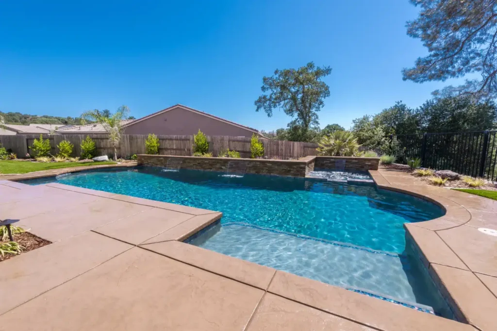 Clear blue pool with surrounding landscape