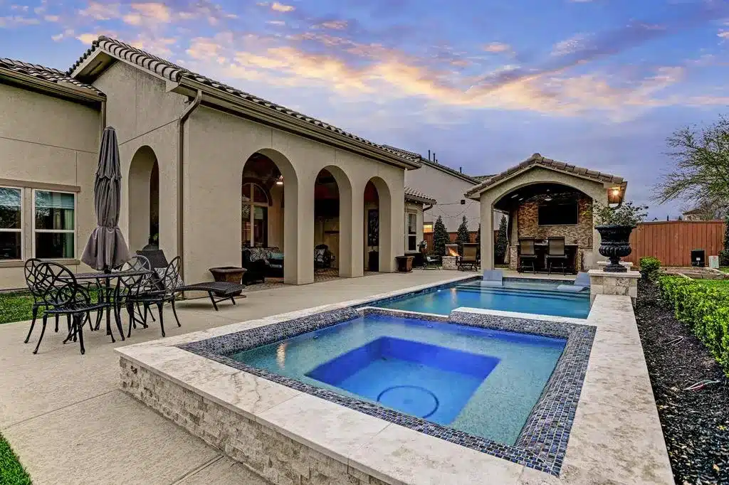 Elegant backyard pool and spa area