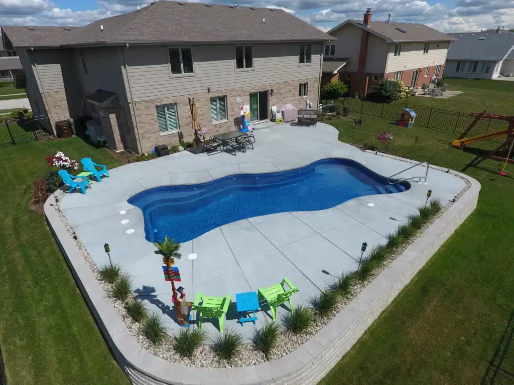 Backyard pool with seating area